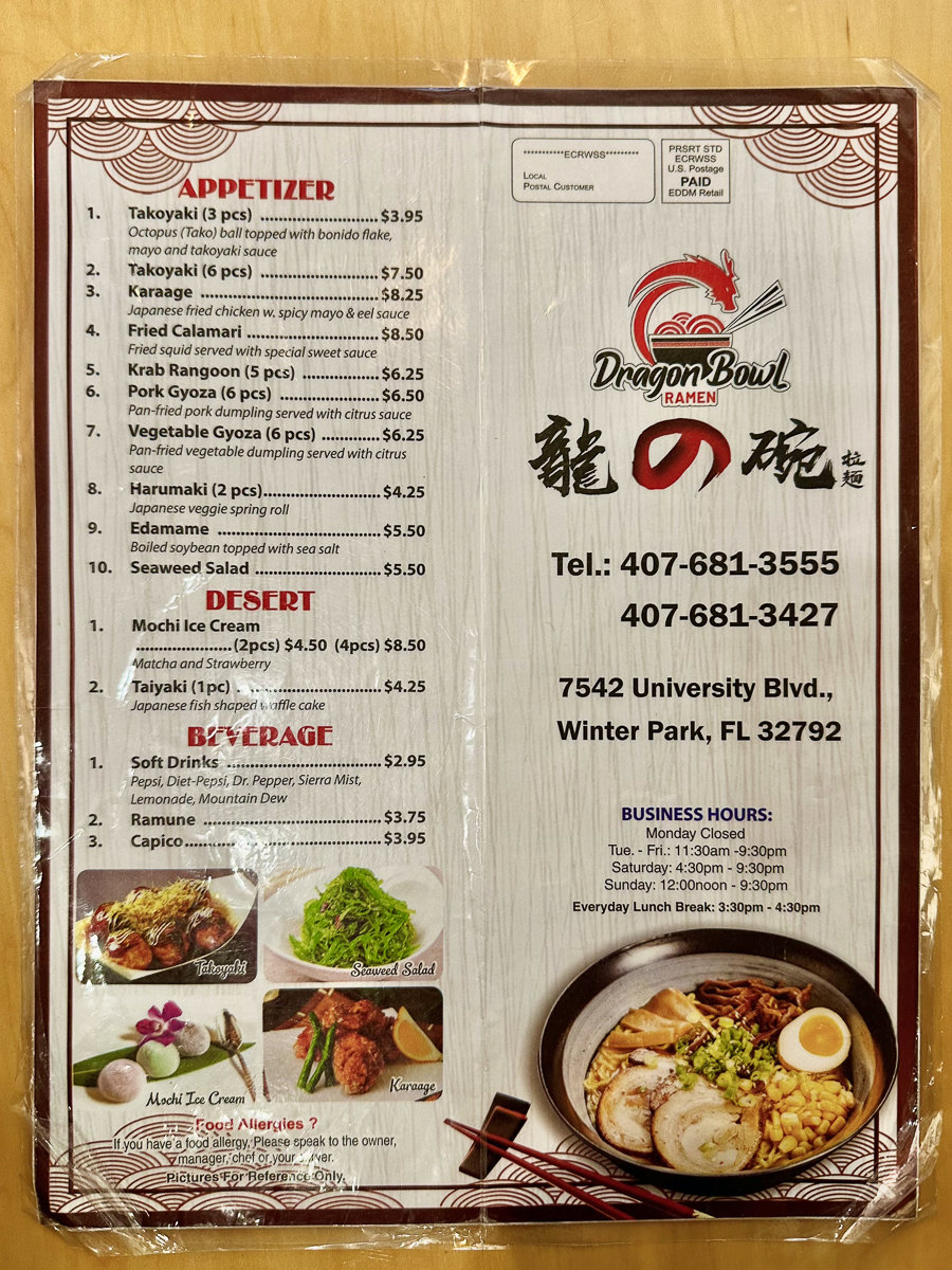 front of white menu with images of japanese dishes